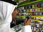 A man looks at a BlackBerry mobile phone A man looks at a BlackBerry mobile phone